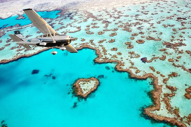 1hour Scenic Flight Heart Reef, Whitehaven Beach, Hill Inlet, GBR - Reaching Heart Reef over the Great Barrier Reef