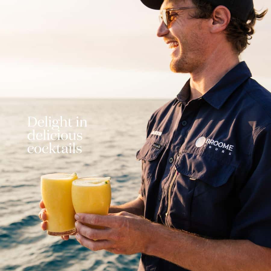 Broome's Iconic Catamaran Sunset Cruise - Boarding the catamaran from the beach