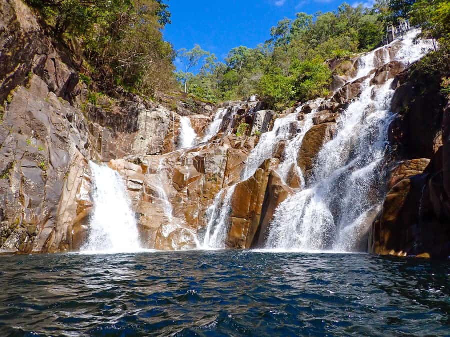 Cairns: Behana Gorge Rainforest Canyoning Tour - Rock slides, jumps, and water caves