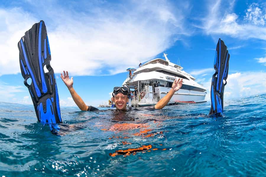 Cairns: Outer Great Barrier Reef Full-Day Tour with Lunch - The Evolution superyacht and the long crossing