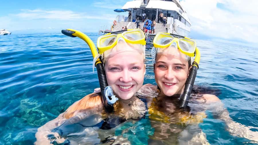 Cairns: Outer Great Barrier Reef Full-Day Tour with Lunch - The return trip, wine, cheese, and photographs
