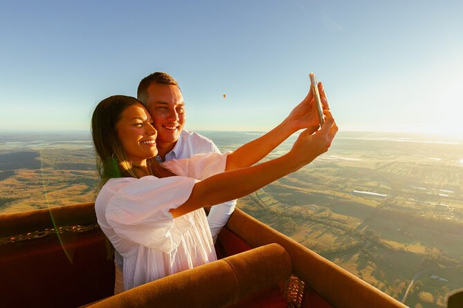 Gold Coast Hot Air Balloon + Winery Breakfast + Return Transfers - Floating over forests, farms, and vineyards