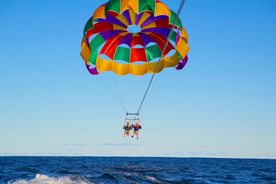 Gold Coast: Surfers Parasailing with Free Photos - Staying dry, or asking for a splash