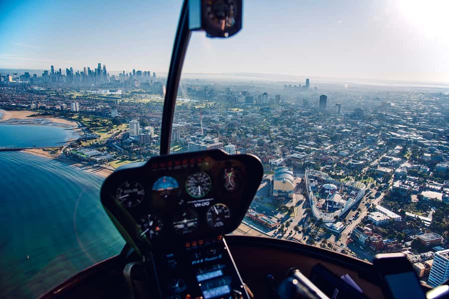 Melbourne: Private City & Beaches Helicopter Ride - Docklands, Melbourne Star, and the route toward Port Phillip Bay