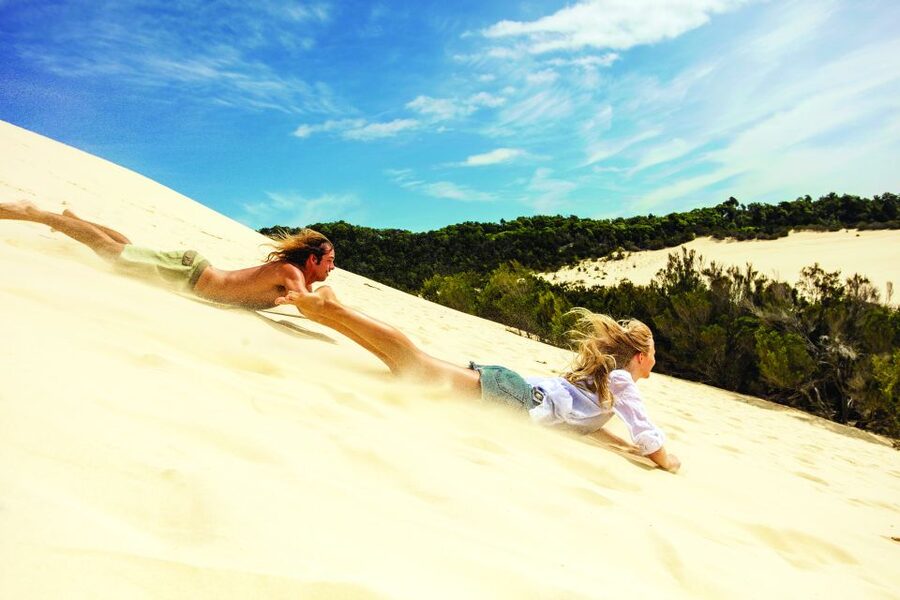 Moreton Island: Desert Safari Tour & Dolphin Viewing - Sand tobogganing supplies the day’s biggest burst of fun