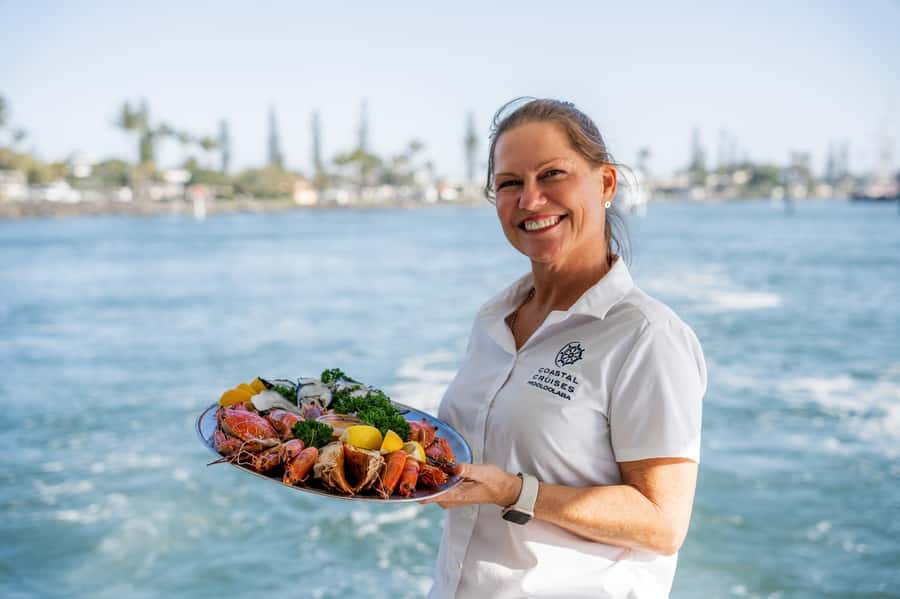 Sunshine Coast: Mooloolaba River Sunset Cruise - Picking up the catch of the day